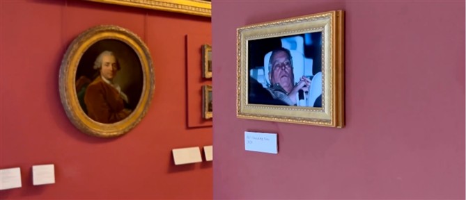 Δίπλα στη...Μόνα Λίζα ο πρίγκιπας Άντριου: Ακτιβιστές κρέμασαν τη φωτογραφία από τη σύλληψή του στο Λούβρο (βίντεο)